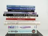 many books stacked on top of each other on a table
