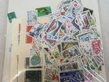 many different stamps on a piece of paper on a table