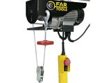 a close up of a small electric hoist on a white background