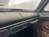 a dashboard of a car with a leopard print seat belt