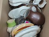a box full of dishes and cups in it