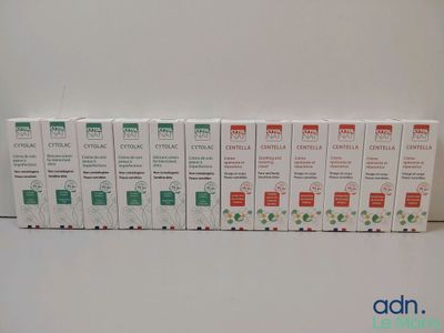 a group of six boxes of toothpaste sitting on top of a table