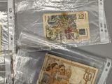 five different types of money in plastic bags on a table