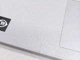a close up of a laptop with a sticker on it