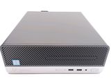 a close up of a small computer on a white surface