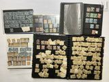 many different types of stamps on display in this case