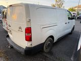a white van that is parked in a parking lot