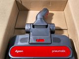 an open box with a vacuum cleaner inside of it