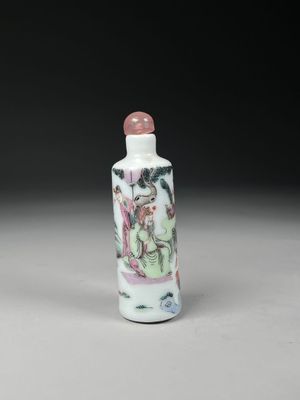 a white and pink glass snuff bottle with a painting on it