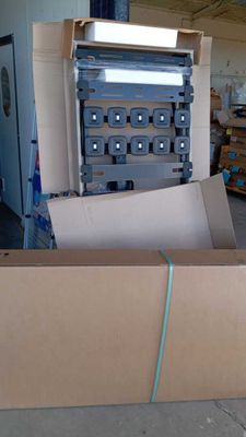a cardboard box with a bunch of electrical equipment inside of it