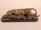 statue of a lion on a marble base on a white background