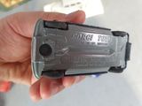 a person holding a toy gun in their hand