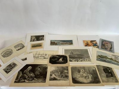 an assortment of old photographs and postcards on display on a table