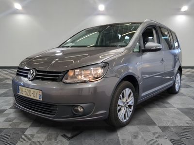 the volkswagen b - cross is parked on a checkered floor in a garage