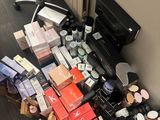 a lot of makeup and makeup products on the floor