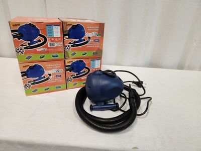 a blue blow dryer sitting on a table next to two boxes