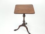 a small table with a wooden top on a white background