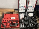 two sets of tools are sitting on the floor next to each other