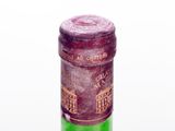 a bottle of wine that is sitting on a table