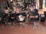 three chairs that are sitting in front of a table