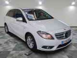 the mercedes b - class is parked on a checkered tile floor