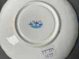 a white plate with a blue and white design on it