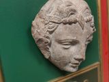 a picture of a plaque of a woman ' s head