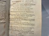 an old book open on a table with some writing on it