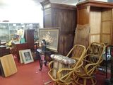 a room with a lot of furniture and pictures on the wall