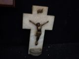 a statue of jesus on a cross on a table