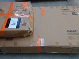 two boxes on top of each other on the floor