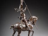 an image of a bronze statue of a man on a horse holding a flag