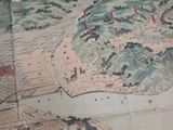 an old map of a city on a table