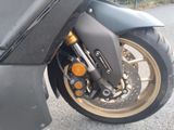 a motorcycle that is parked on the side of the road