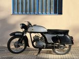 a motorcycle that is parked in front of a building