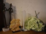 a vase of flowers and two candles on a table