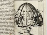 an open book with a drawing of a man in front of a large object