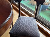 a chair that is sitting in front of a window
