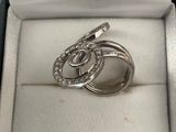 a close up of a ring in a box on a table