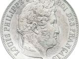 a close up of a silver coin with a woman ' s face on it
