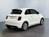 the back of a white car is parked in a white room