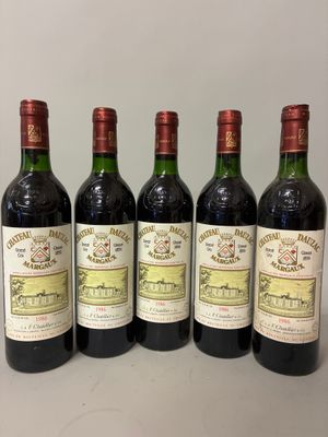 six bottles of wine are lined up on a table