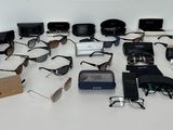 a lot of electronic gadgets on a white table