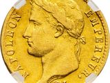 a close up of a gold coin with a woman ' s head on it