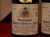 two bottles of wine that are sitting on a table