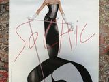 a poster of a woman in a black dress with a red hat