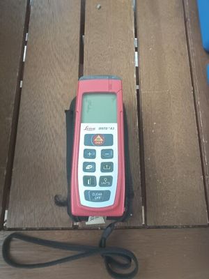 a cell phone that is sitting on a wooden table