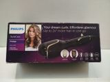 packaging of a hair dryer sitting on top of a white table
