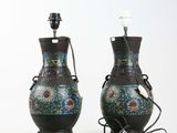two vases that are sitting next to each other on a table