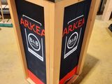 a wooden box with a black and red label on it